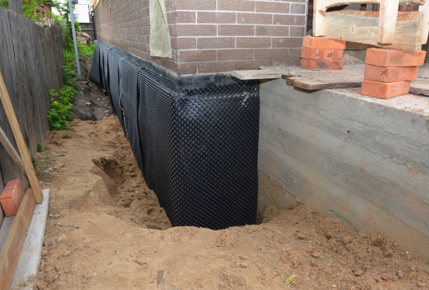 Happy homeowners after waterproofing job in West Babylon
